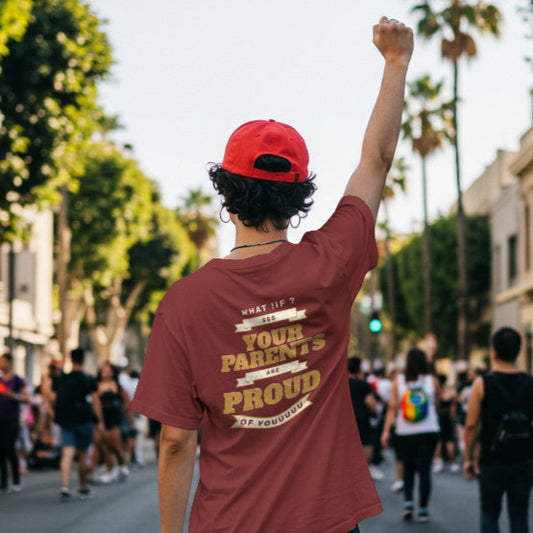 Person wearing a red cap and maroon t-shirt with text,